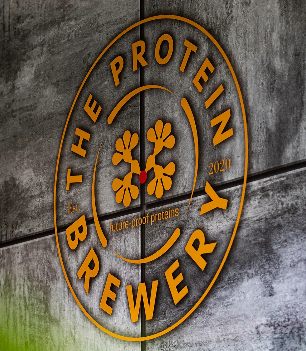 The Protein Brewery logo on a wall, seen from an angle